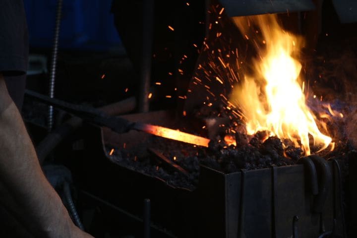 A coal forge burning hot in the VIB shop