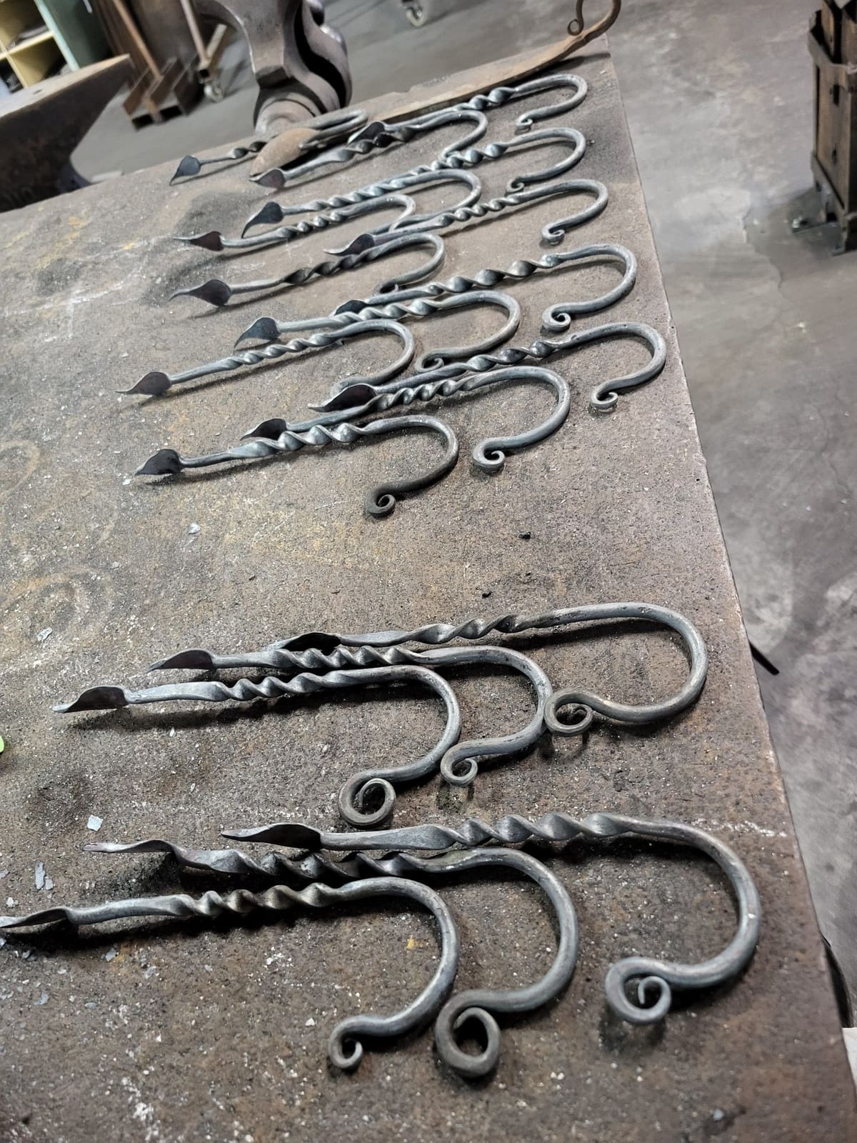 Forged twisted hooks on an anvil